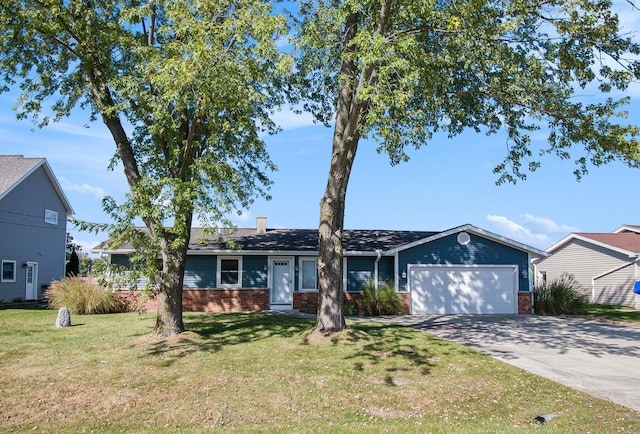 ranch-style house featuring a garage and a front yard