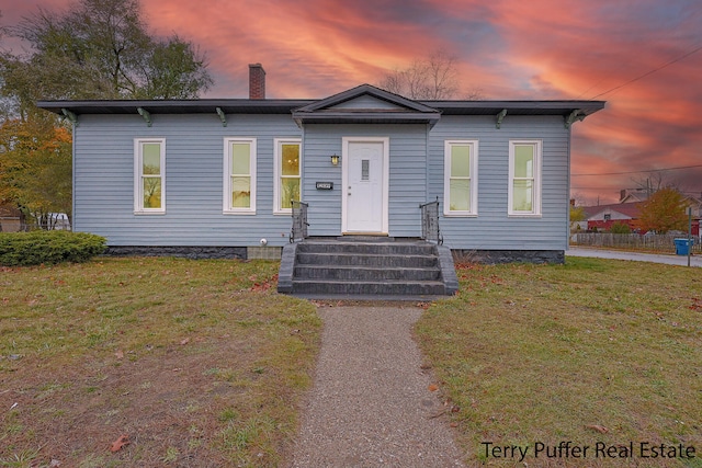 view of front of house with a lawn