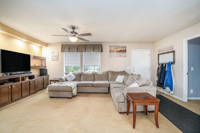 carpeted living room featuring ceiling fan