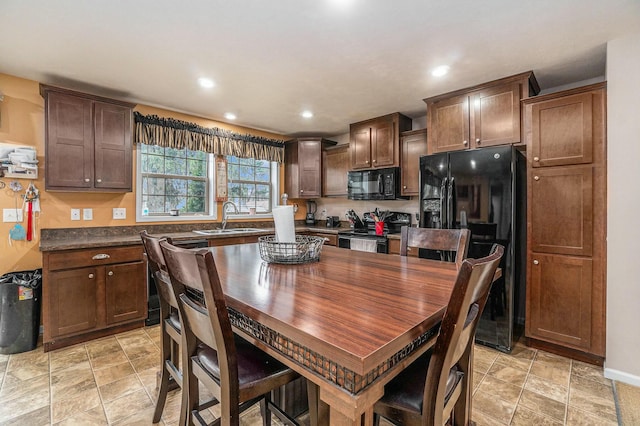 kitchen with black appliances and sink