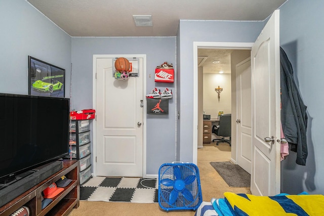 bedroom featuring light carpet