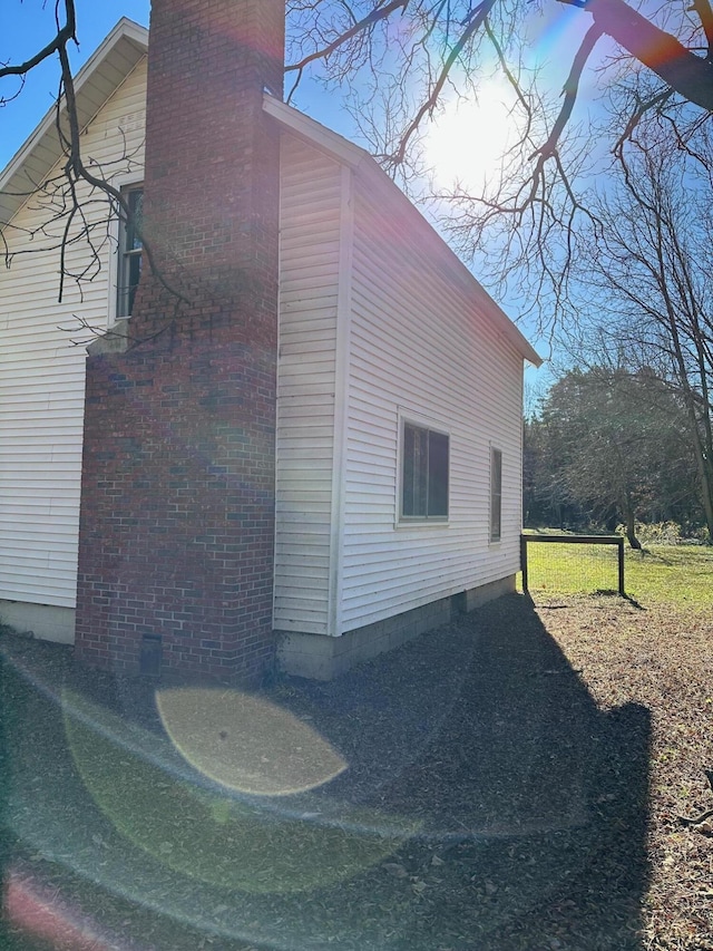 view of side of property featuring a lawn