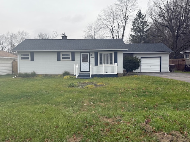 single story home featuring covered porch, a front yard, and a garage