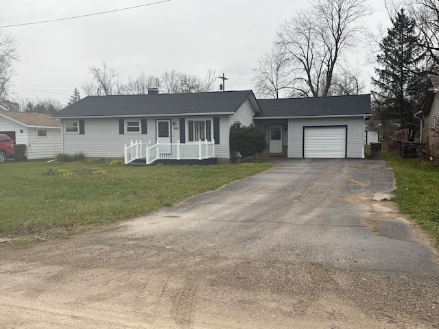 ranch-style house with a front lawn and a garage