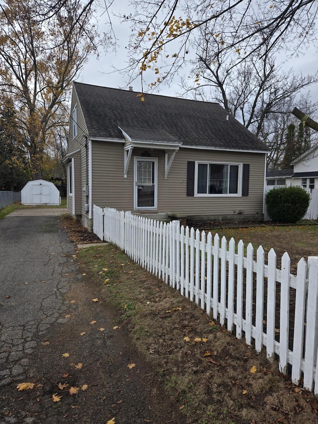 view of side of home featuring an outdoor structure