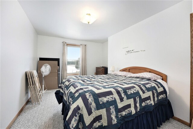 bedroom with light colored carpet