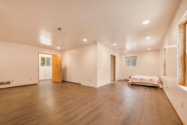 unfurnished bedroom with hardwood / wood-style flooring