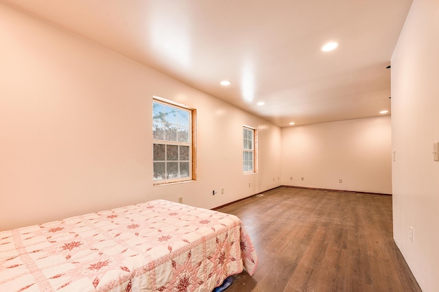 bedroom with hardwood / wood-style flooring