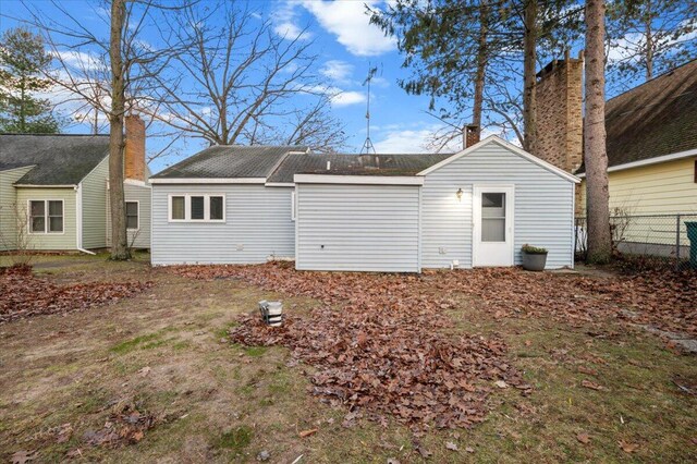 rear view of house with fence