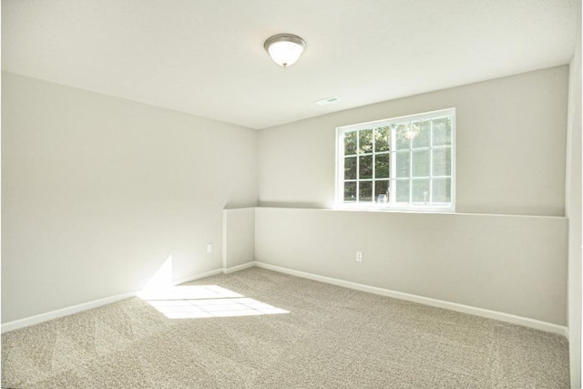 unfurnished room featuring carpet