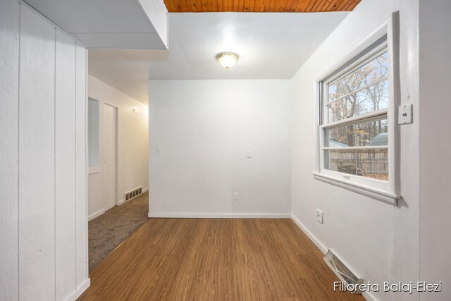 unfurnished room with wood-type flooring