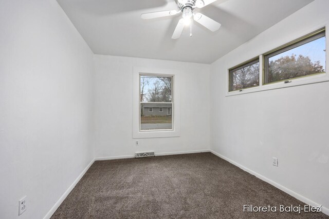 carpeted empty room featuring ceiling fan