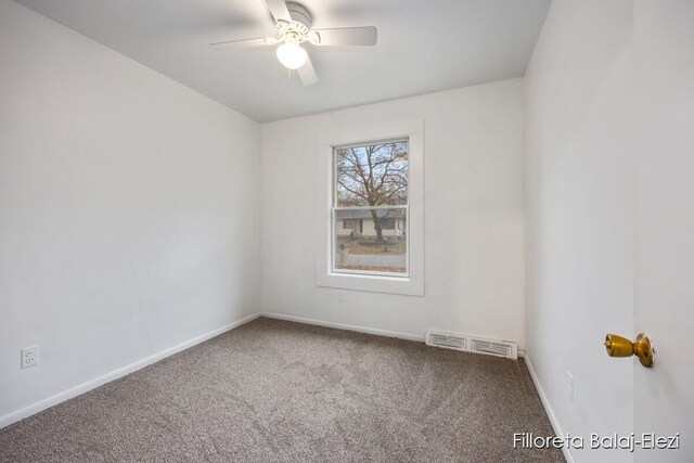 carpeted empty room featuring ceiling fan