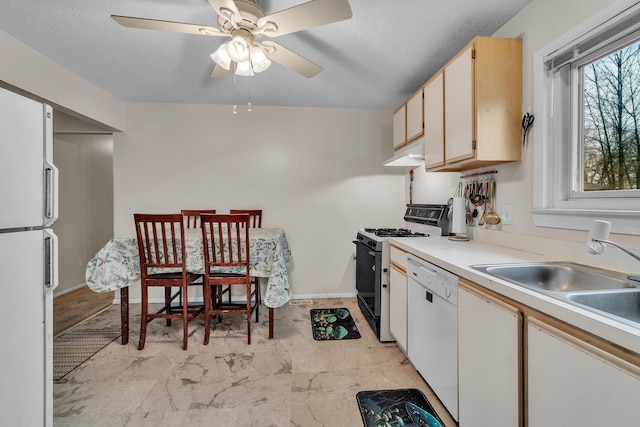 kitchen with white appliances, sink, ceiling fan, a textured ceiling, and white cabinetry