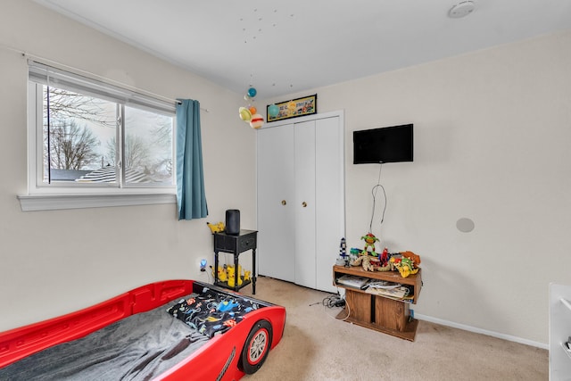 carpeted bedroom with a closet