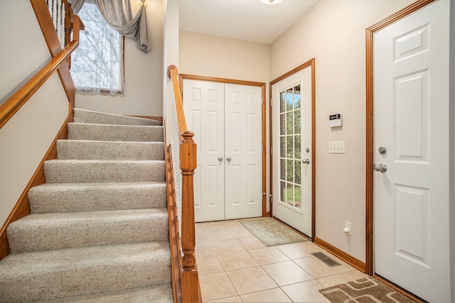 entrance foyer with light tile patterned floors