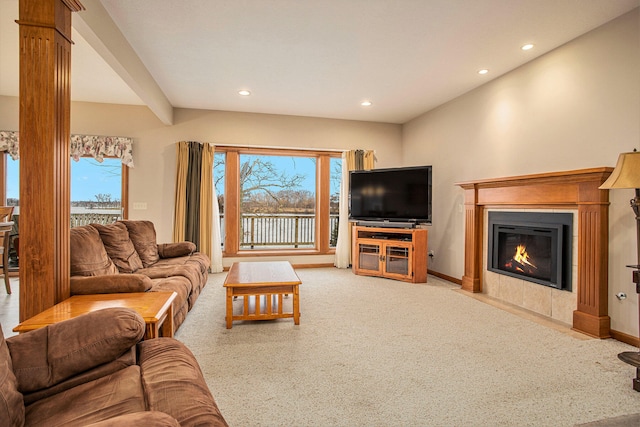 living room with a healthy amount of sunlight and light colored carpet