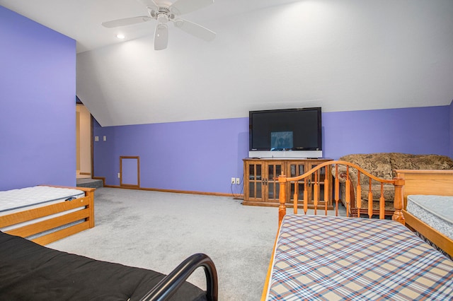 bedroom featuring ceiling fan, lofted ceiling, and carpet floors