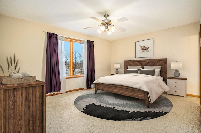 bedroom featuring ceiling fan and light colored carpet