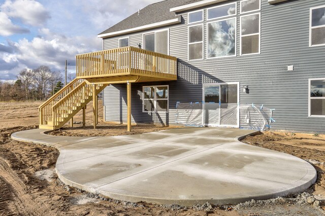 back of house with a patio area and a deck