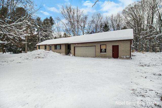 view of snow covered garage