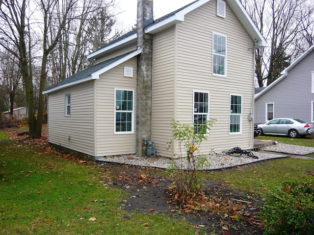 view of home's exterior featuring a lawn