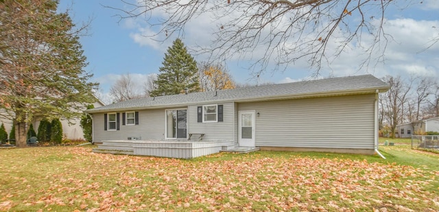 back of house with a yard