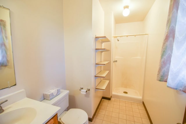 bathroom with vanity, toilet, and walk in shower