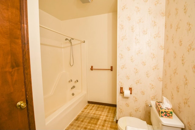 bathroom featuring toilet and tub / shower combination