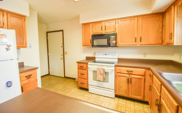 kitchen with sink and white appliances