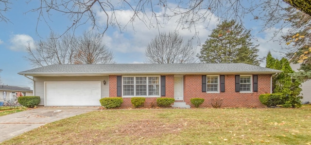 single story home featuring a front lawn and a garage