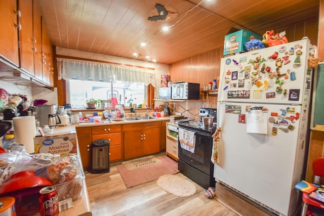 kitchen featuring white refrigerator, wood ceiling, and black / electric stove