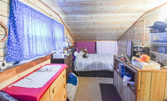 bedroom featuring carpet, wood walls, wood ceiling, and vaulted ceiling