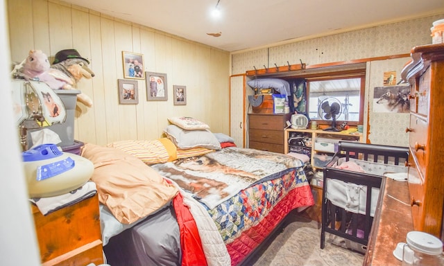 bedroom with wood walls