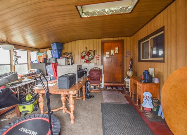 home office featuring wooden walls, wooden ceiling, and lofted ceiling