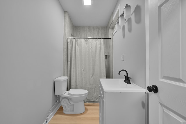 7564 13 Mile Rd NE, Rockford, MI 49341 - bathroom featuring toilet, vanity, wood-type flooring, and walk in shower