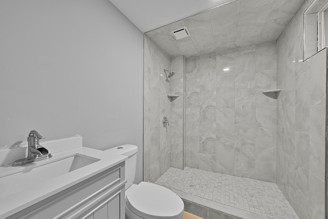 7564 13 Mile Rd NE, Rockford, MI 49341 - bathroom featuring tiled shower, vanity, and toilet