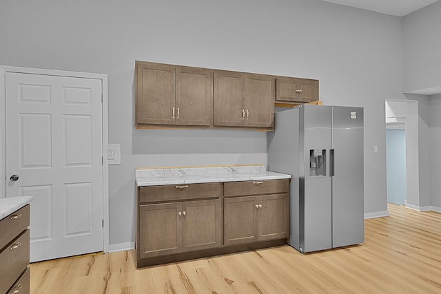 7564 13 Mile Rd NE, Rockford, MI 49341 - kitchen with stainless steel refrigerator with ice dispenser and light wood-type flooring