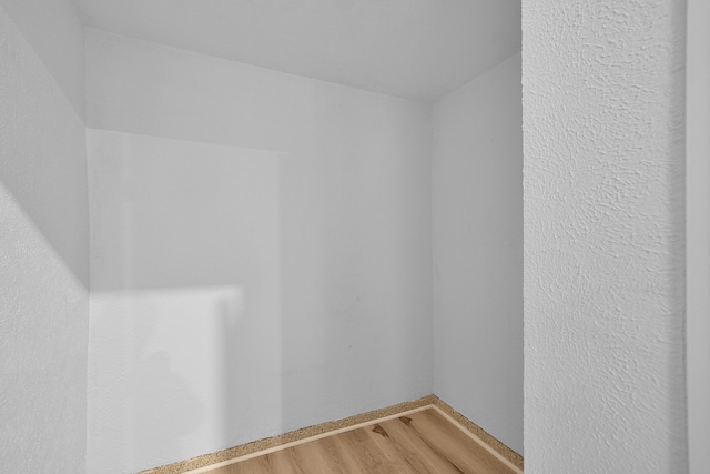 7564 13 Mile Rd NE, Rockford, MI 49341 - empty room featuring hardwood / wood-style floors