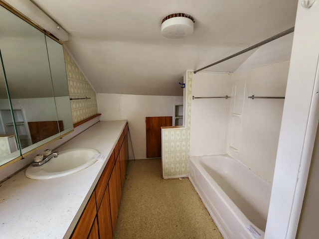 bathroom featuring vanity and vaulted ceiling