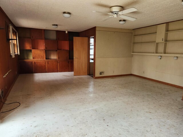 spare room featuring a textured ceiling and ceiling fan