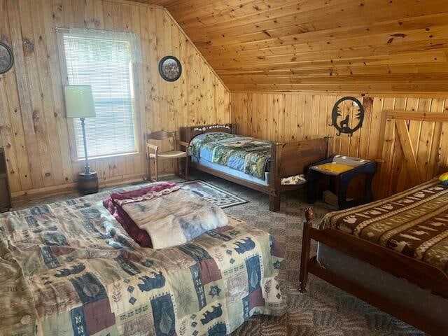 carpeted bedroom featuring wooden ceiling, lofted ceiling, and wood walls