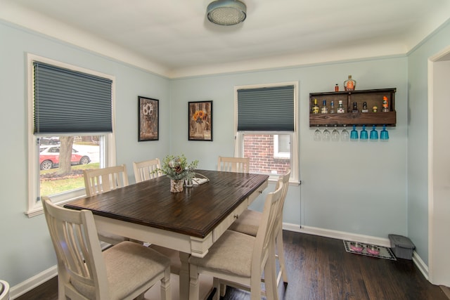 dining room with dark wood-type flooring