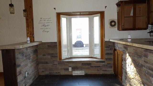 kitchen featuring dark tile patterned floors