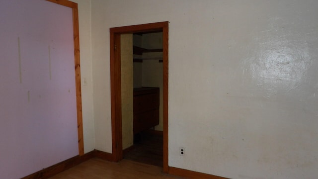 empty room with hardwood / wood-style flooring