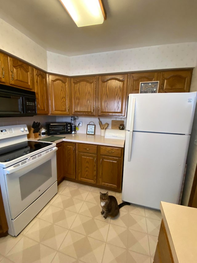 kitchen featuring white appliances