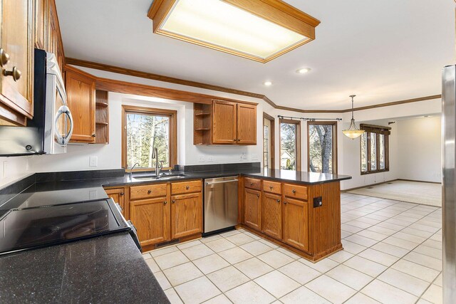 kitchen with kitchen peninsula, ornamental molding, sink, pendant lighting, and dishwasher