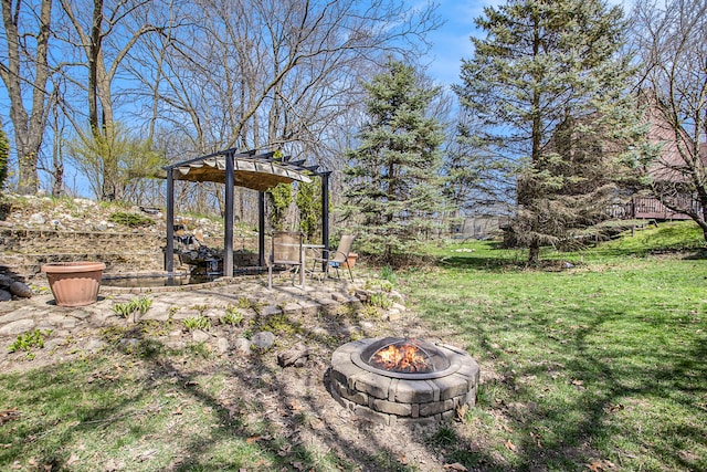 view of yard with an outdoor fire pit