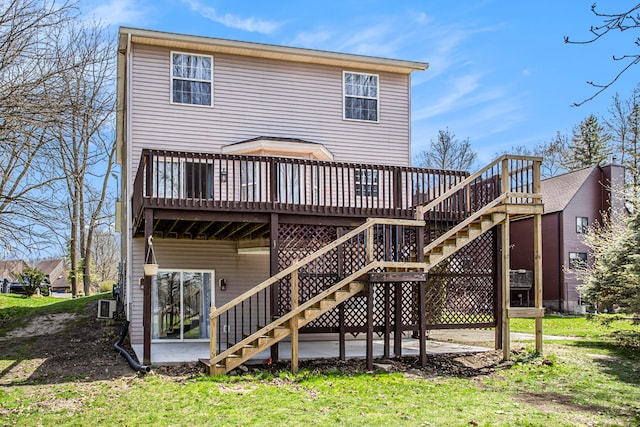 back of property featuring a patio, a deck, and central AC unit