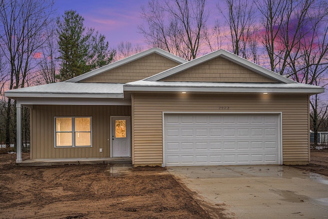 view of front of property with a garage